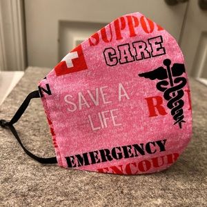 Woman mask Color: Pink, whit red and black letters